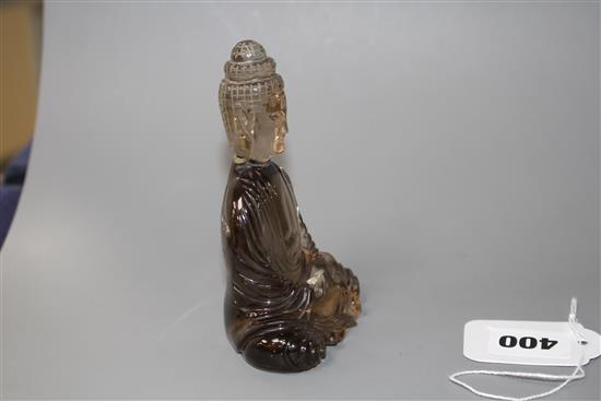 A Chinese smoky quartz seated figure of Guanyin, 19th/early 20th century, H. 11.5cm
